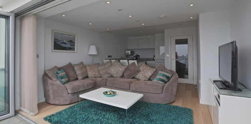 Bright, modern living room at Fistral Blue apartment, Newquay